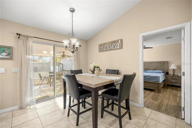 a dining room with furniture and window
