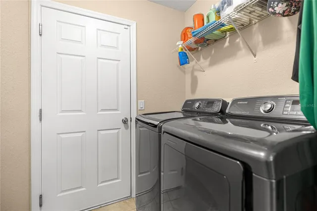a close view of a utility room with washer and dryer