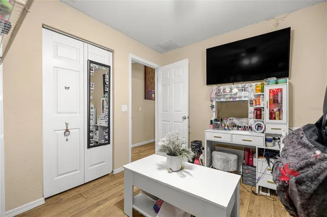 a living room with fireplace furniture and a flat screen tv