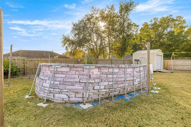 a view of a pathway with a garden