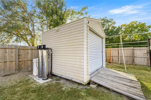 a view of a backyard with a small cabin