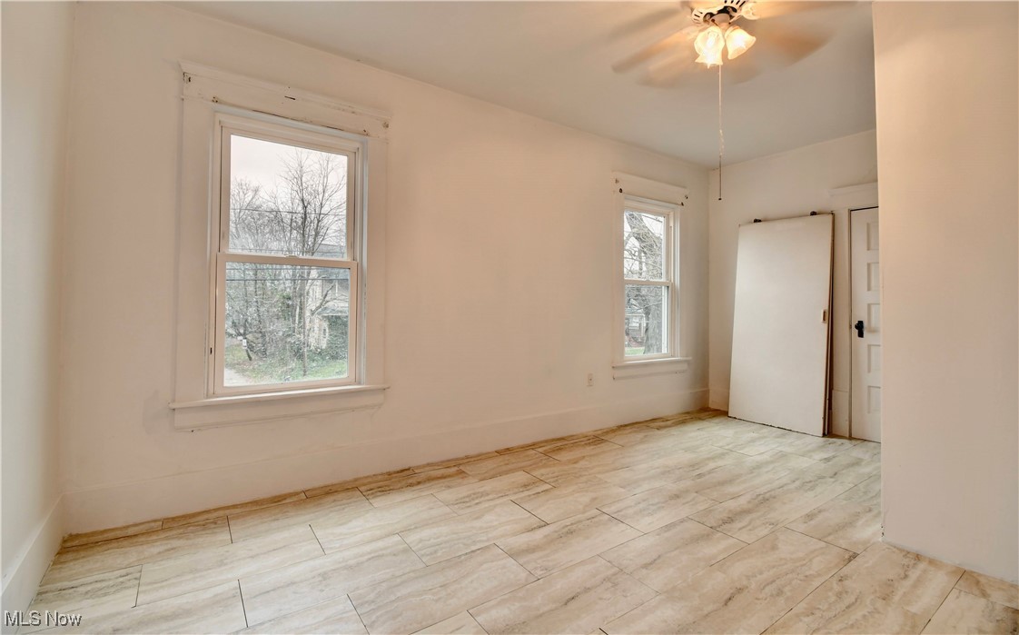813 Dayton Street Akron, OH 44310 - Photo 19 of 29 Unfurnished room with a ceiling fan and baseboards