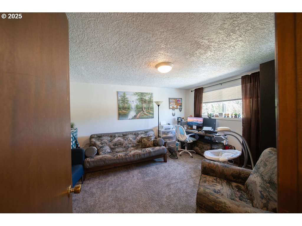 3689 Southeast 14th Street Gresham, OR 97080 - Photo 24 of 35 a living room with furniture and a window