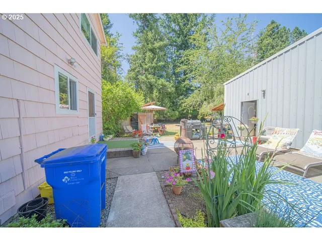 a view of a patio with couches and potted plants