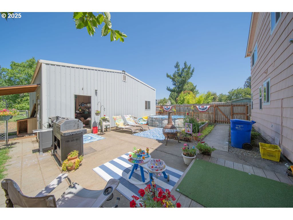 3689 Southeast 14th Street Gresham, OR 97080 - Photo 27 of 35 a view of a patio with couches and potted plants