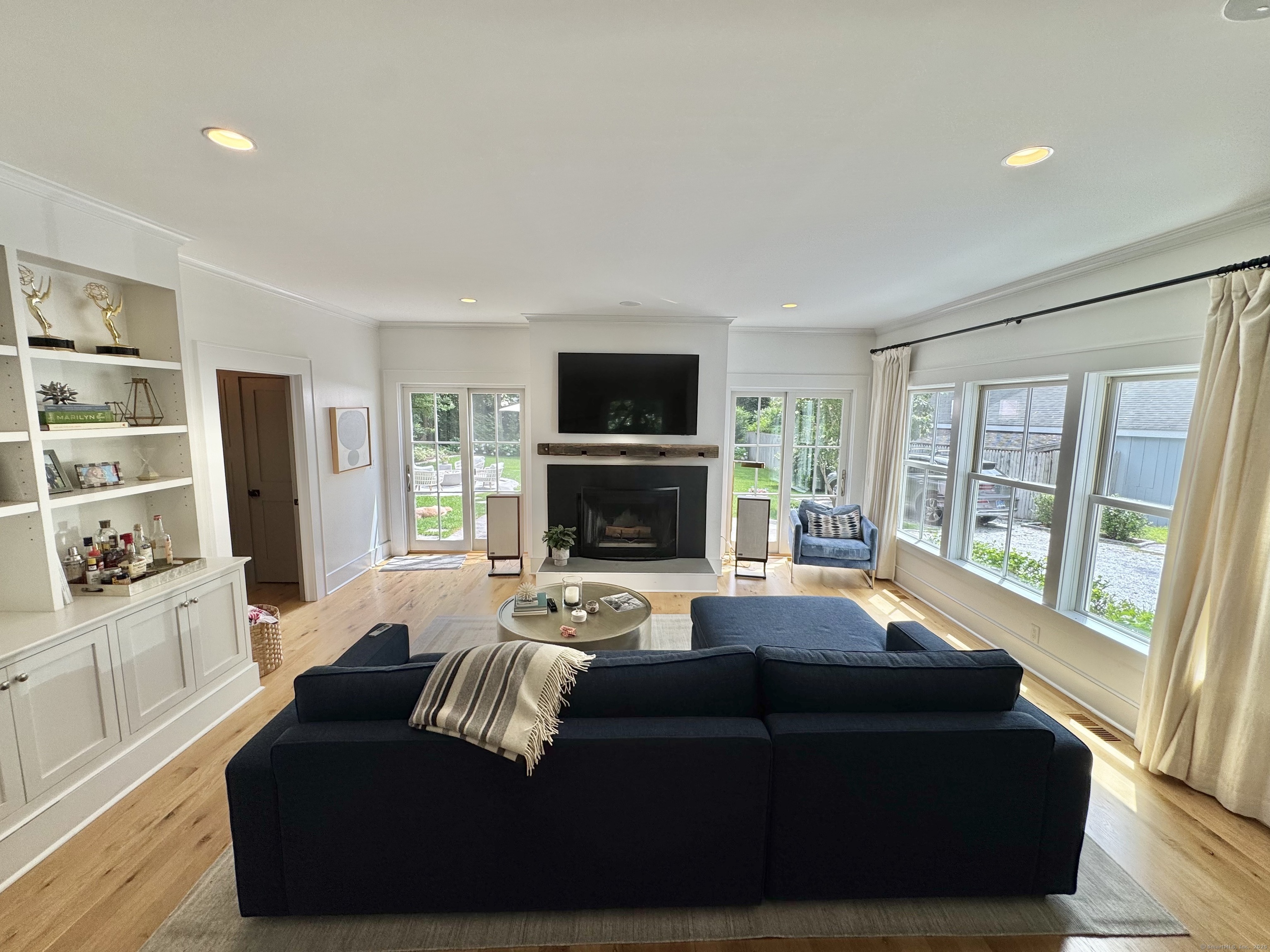 18 Englewood Road Norwalk, CT 06853 - Photo 12 of 25 a living room with furniture and a fireplace