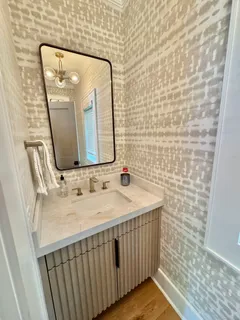 a bathroom with a sink and a mirror