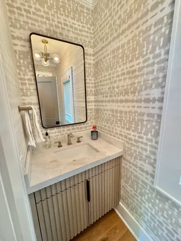 a bathroom with a sink and a mirror