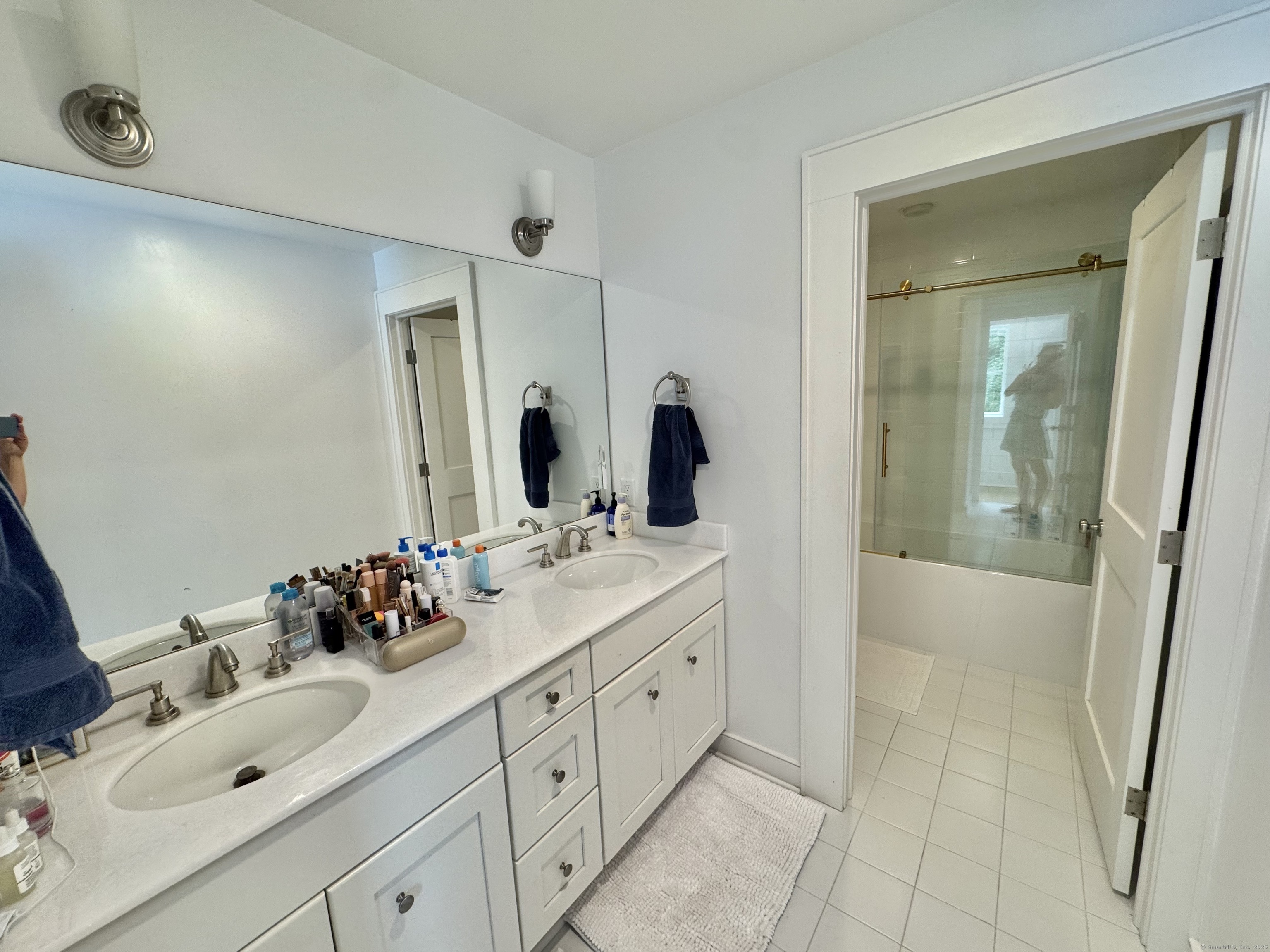 18 Englewood Road Norwalk, CT 06853 - Photo 20 of 25 a bathroom with a double vanity sink mirror and double