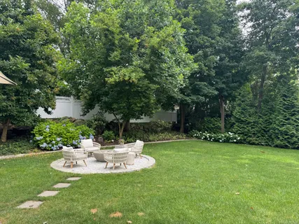 a view of a chair and table of the garden