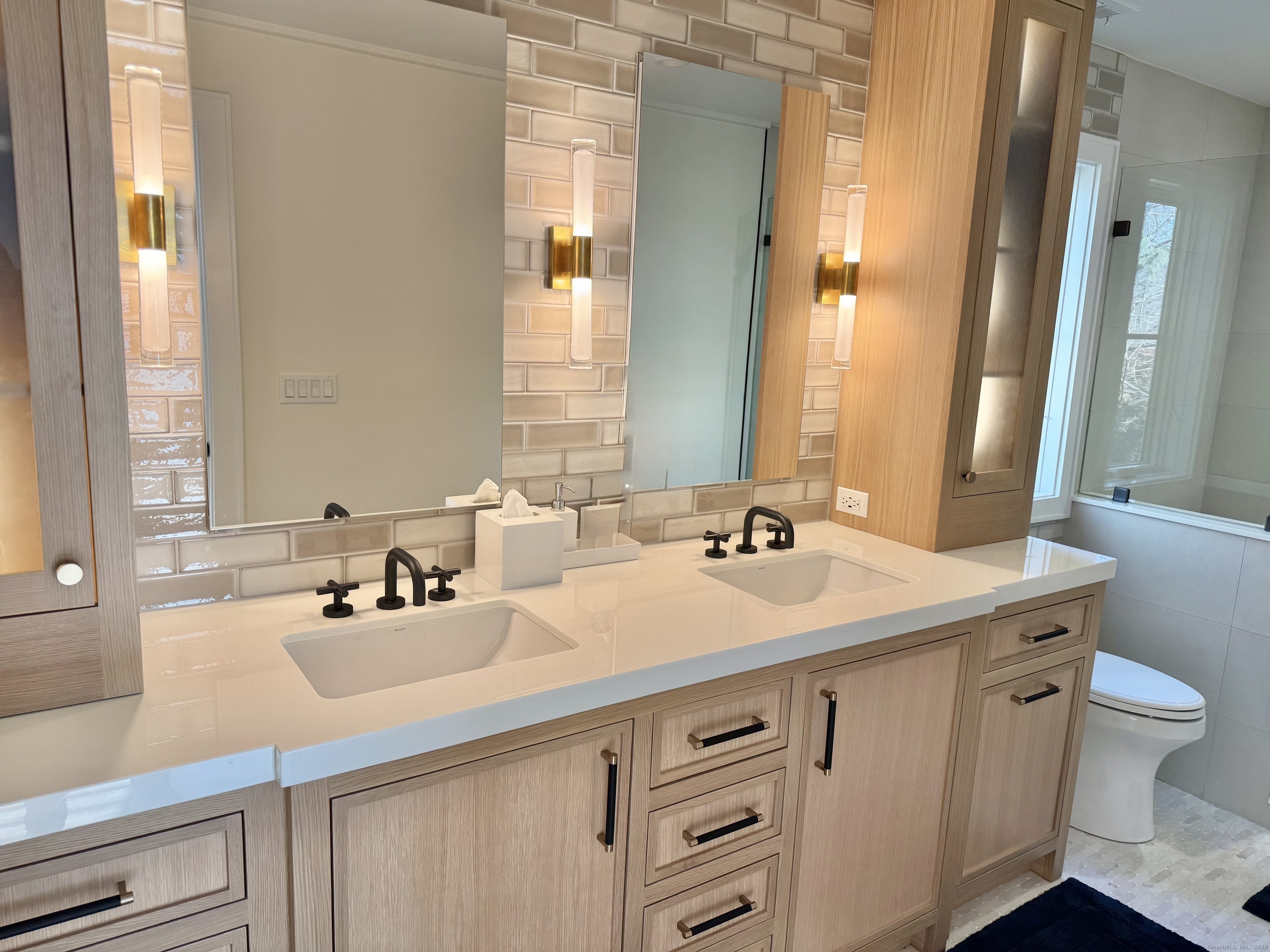 18 Englewood Road Norwalk, CT 06853 - Photo 8 of 25 a bathroom with a sink and a mirror with toilet