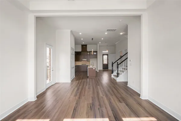a view of a living room with wooden floor