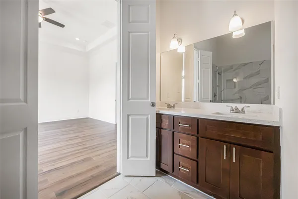 a bathroom with a sink double vanity and a mirror