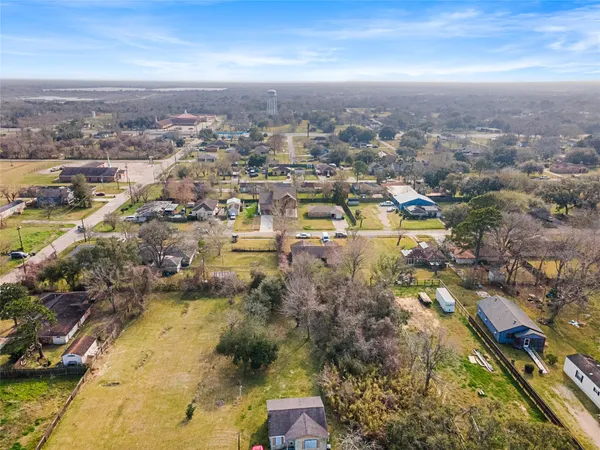 an aerial view of residential building and lake