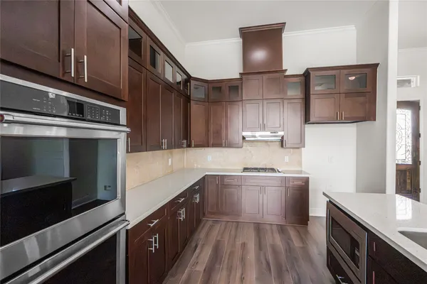 a kitchen with a sink and cabinets