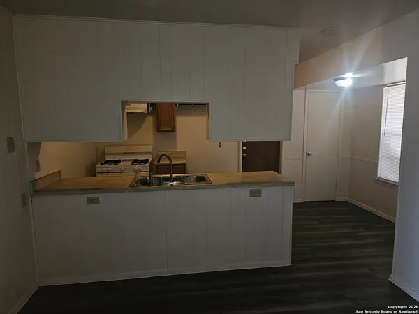 a living room with furniture and flat screen tv
