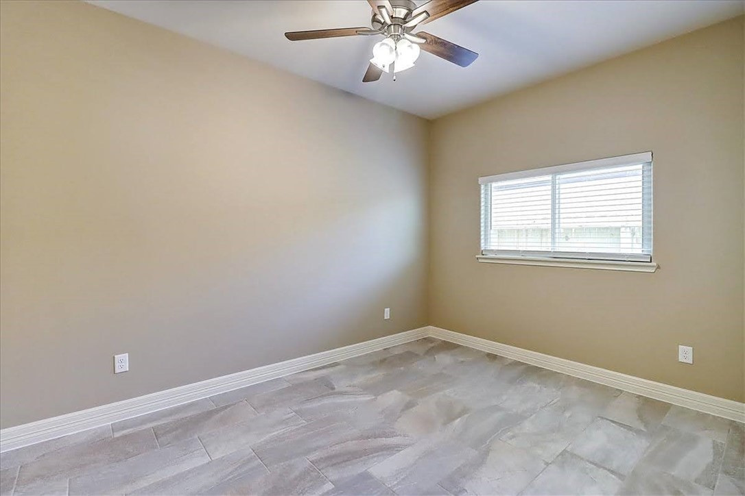 3153 Seawolf Corpus Christi, TX 78414 - Photo 27 of 40 an empty room with a window and a fan