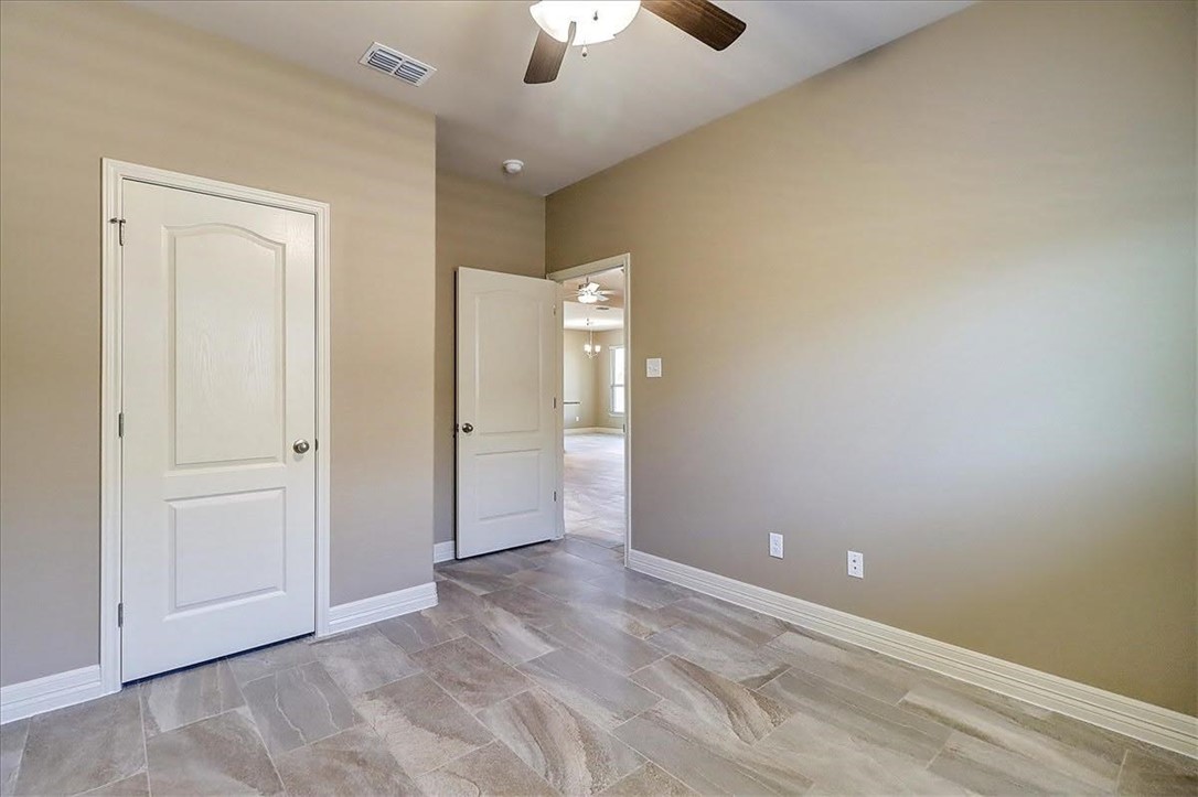 3153 Seawolf Corpus Christi, TX 78414 - Photo 32 of 40 an empty room with fan and entrance