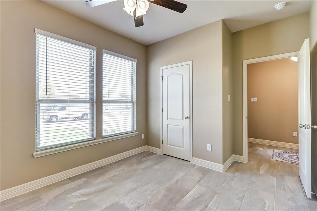 3153 Seawolf Corpus Christi, TX 78414 - Photo 34 of 40 a view of an empty room with chandelier fan and fire place