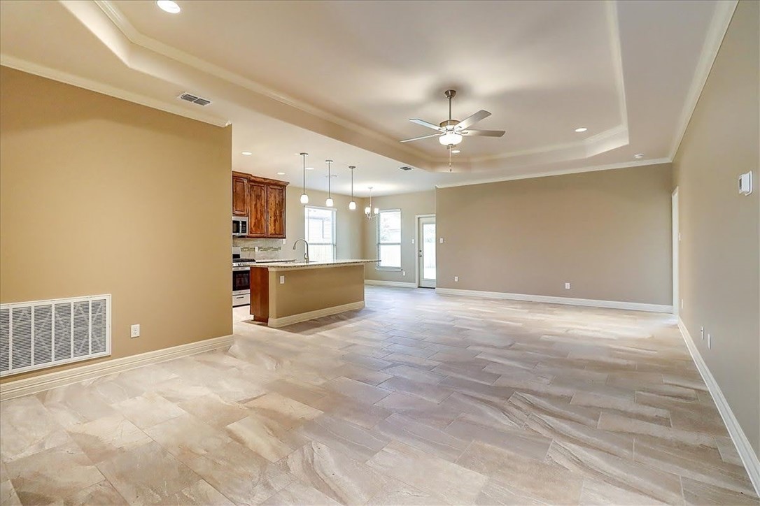 3153 Seawolf Corpus Christi, TX 78414 - Photo 9 of 40 a view of a kitchen with a sink and a cabinet a fireplace