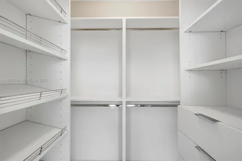 a kitchen with metallic refrigerator freezer and a dishwasher