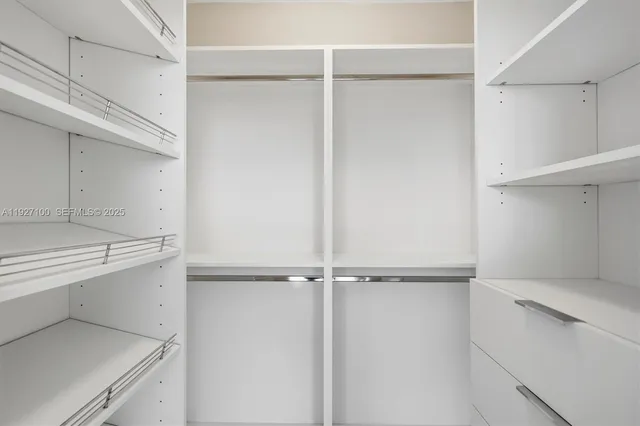 a kitchen with metallic refrigerator freezer and a dishwasher