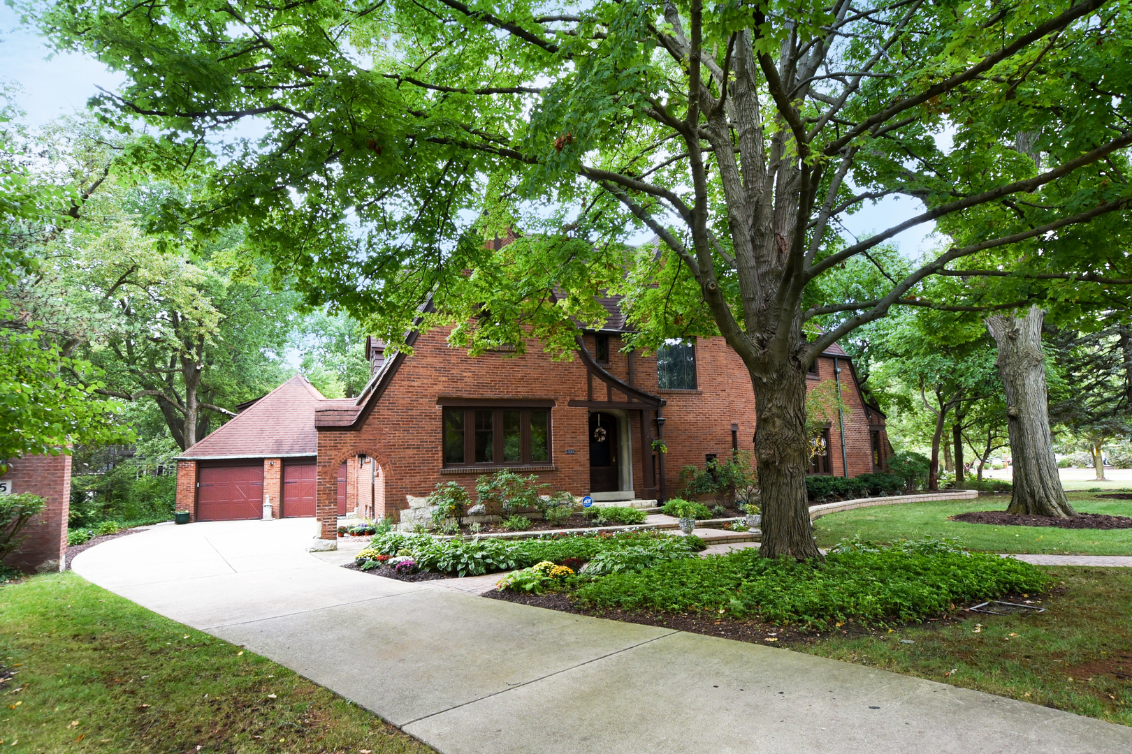 95 Michaux Road Riverside, IL 60546 - Photo 2 of 48 a front view of a house with garden