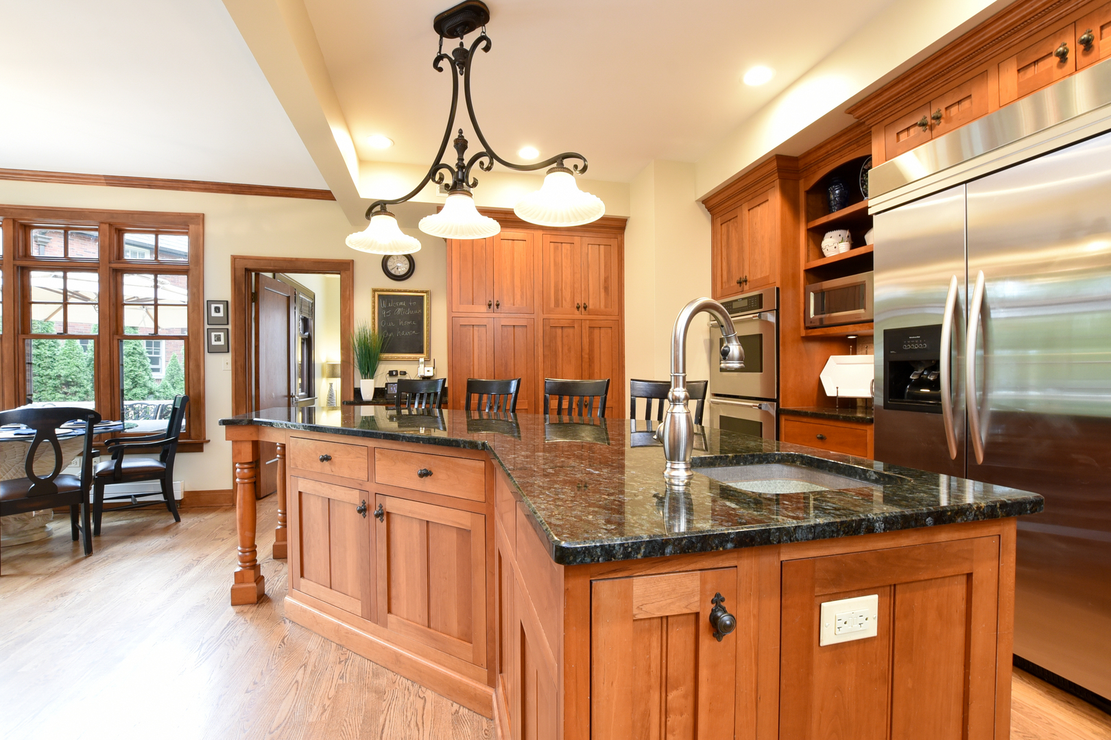 95 Michaux Road Riverside, IL 60546 - Photo 19 of 48 a kitchen with stainless steel appliances granite countertop a sink a stove counter space and living room view