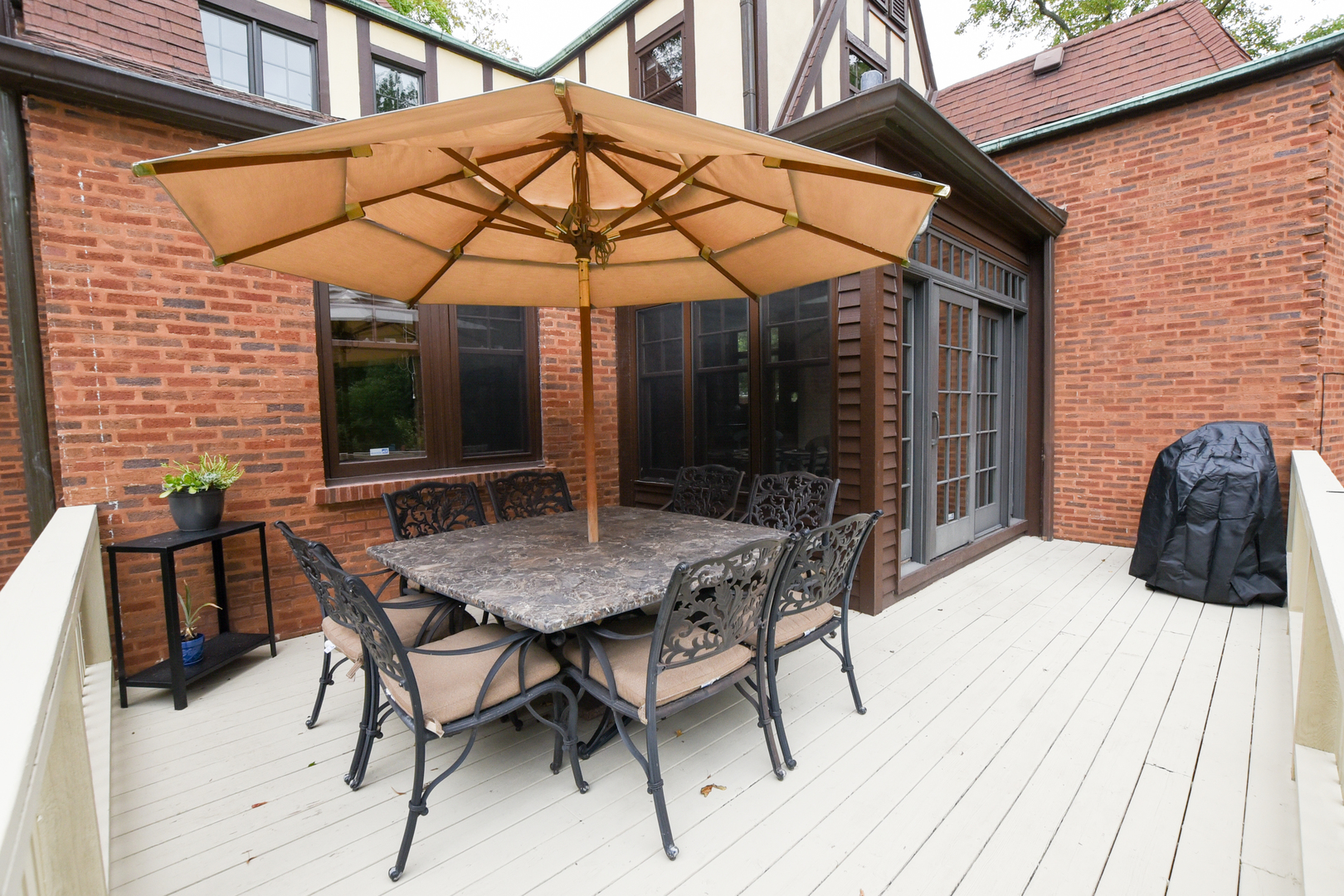95 Michaux Road Riverside, IL 60546 - Photo 44 of 48 a view of a patio with a table and chairs under an umbrella