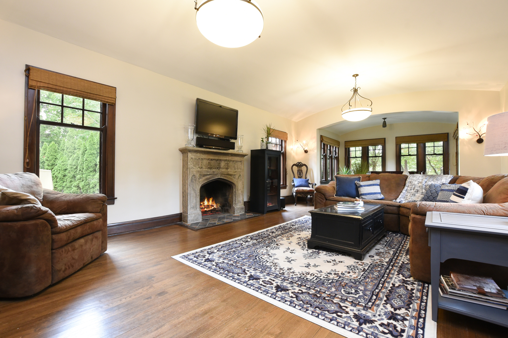 95 Michaux Road Riverside, IL 60546 - Photo 7 of 48 a living room with furniture a fireplace and a flat screen tv