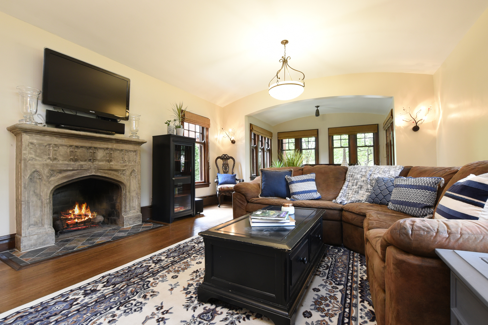 95 Michaux Road Riverside, IL 60546 - Photo 10 of 48 a living room with furniture a flat screen tv and a fireplace