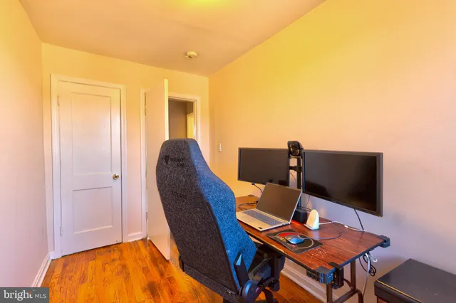 a workspace with furniture and wooden floor