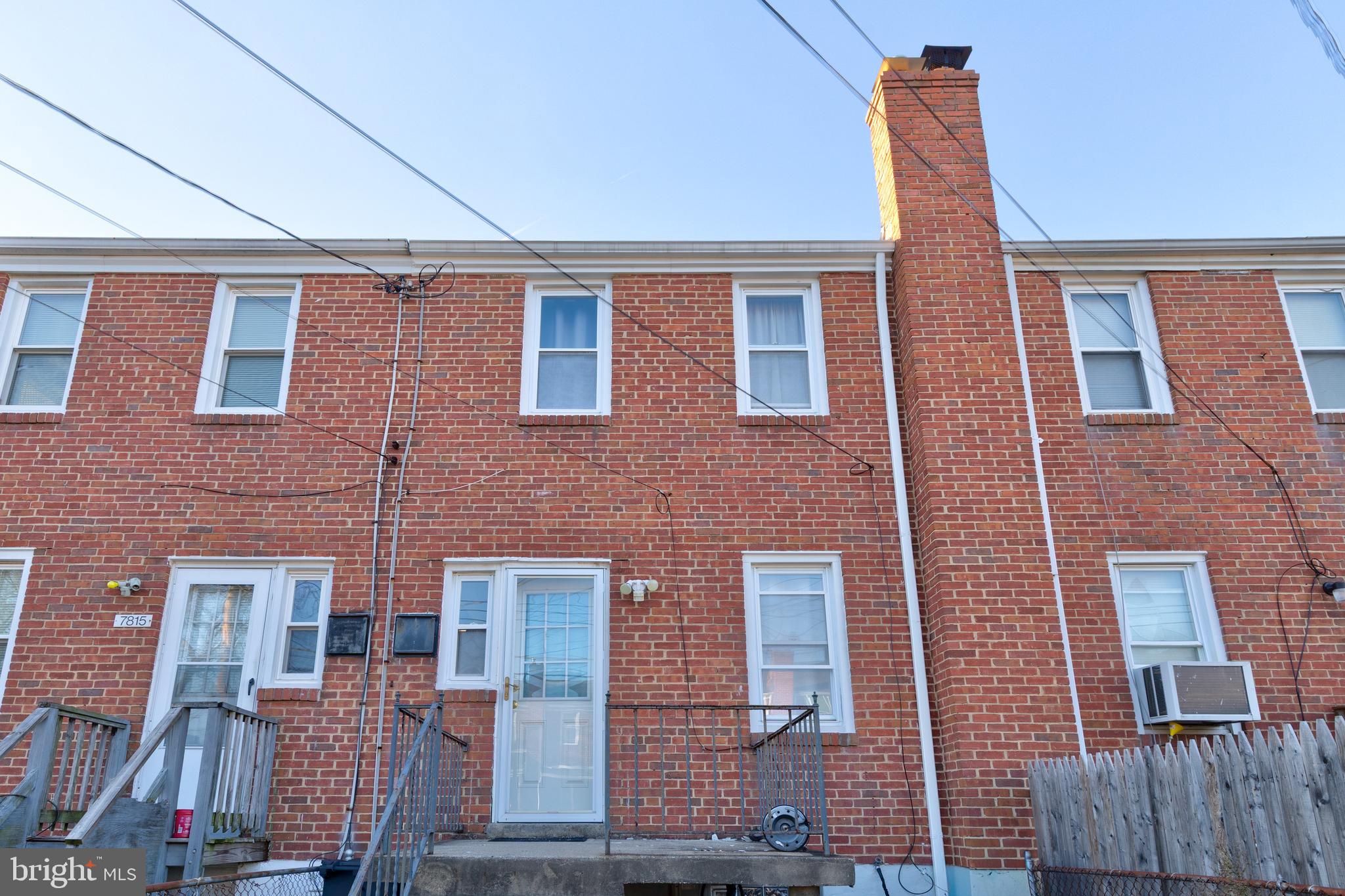 7817 St Fabian Lane Baltimore, MD 21222 - Photo 16 of 17 a front view of a building with glass windows