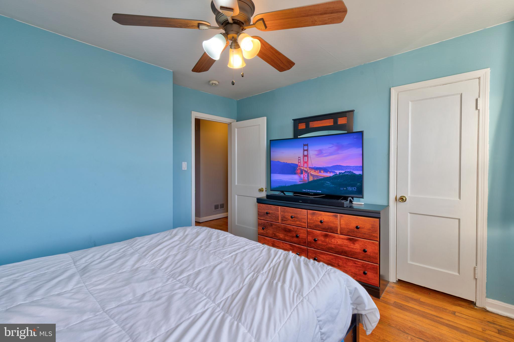 7817 St Fabian Lane Baltimore, MD 21222 - Photo 10 of 17 a bedroom with a bed and a flat screen tv