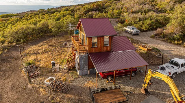 a view of a house with wooden fence