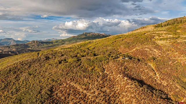 a view of a street with an ocean