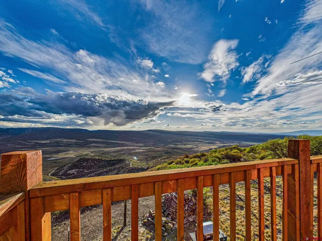 a bedroom with a bed and a desk