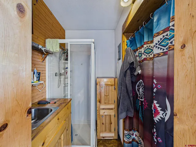 a bed room with a bed and a painting on the wall