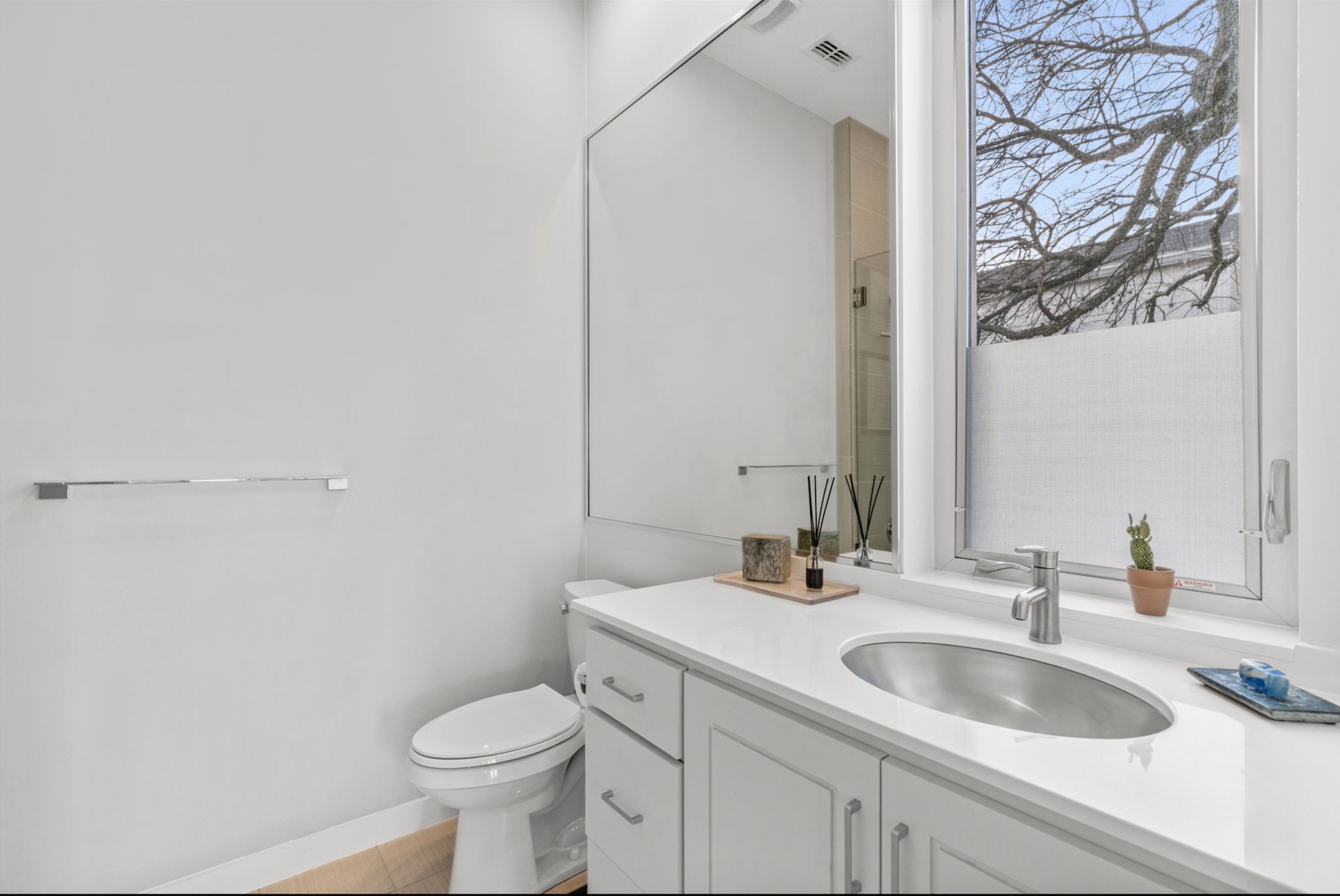 1608 Ravey Street, Unit B Austin, TX 78704 - Photo 17 of 25 Bathroom featuring vanity and toilet
