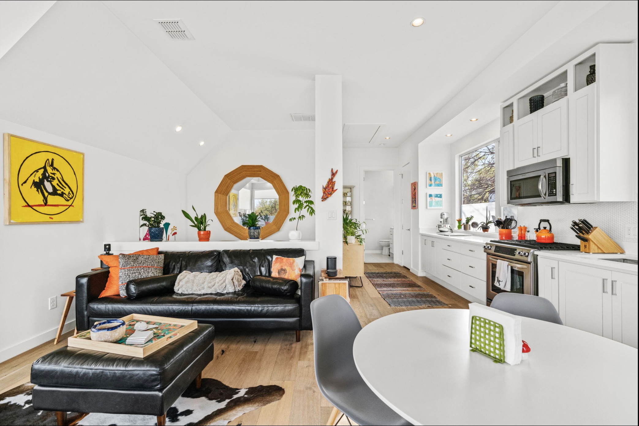 Living room featuring recessed lighting, lofted ceiling, and light wood finished floors