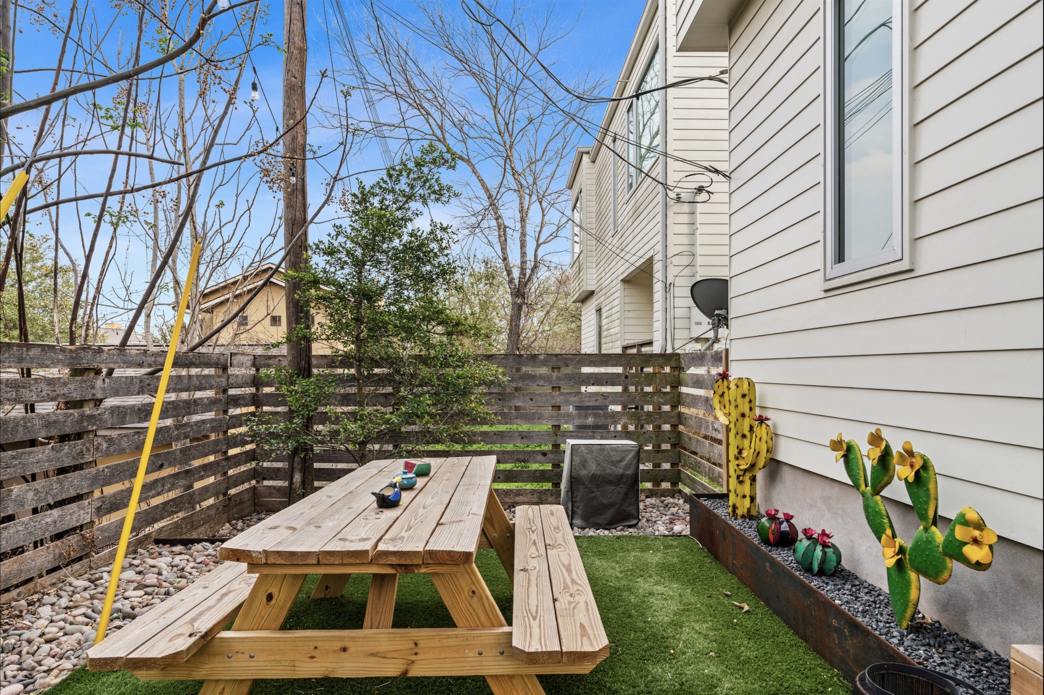 1608 Ravey Street, Unit B Austin, TX 78704 - Photo 4 of 25 Fenced backyard featuring outdoor dining area