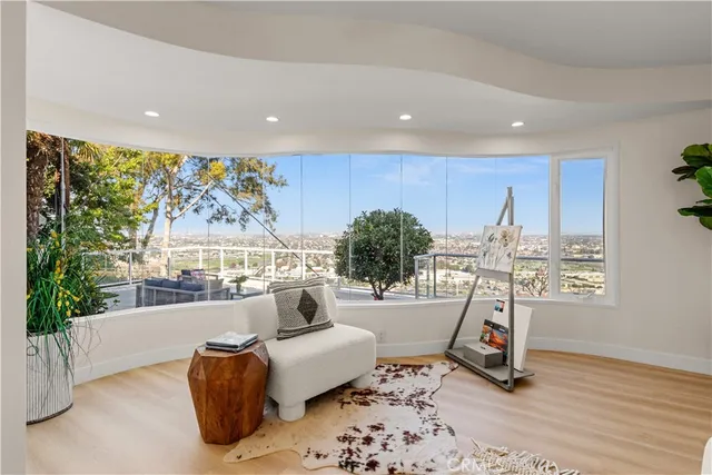 a view of a living room and a floor to ceiling window