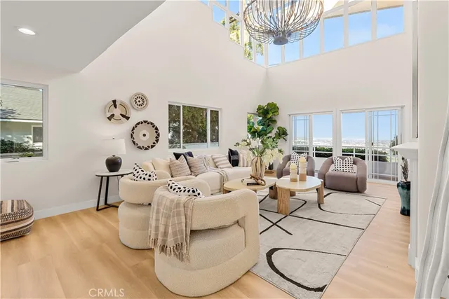 a living room with furniture a clock and a table