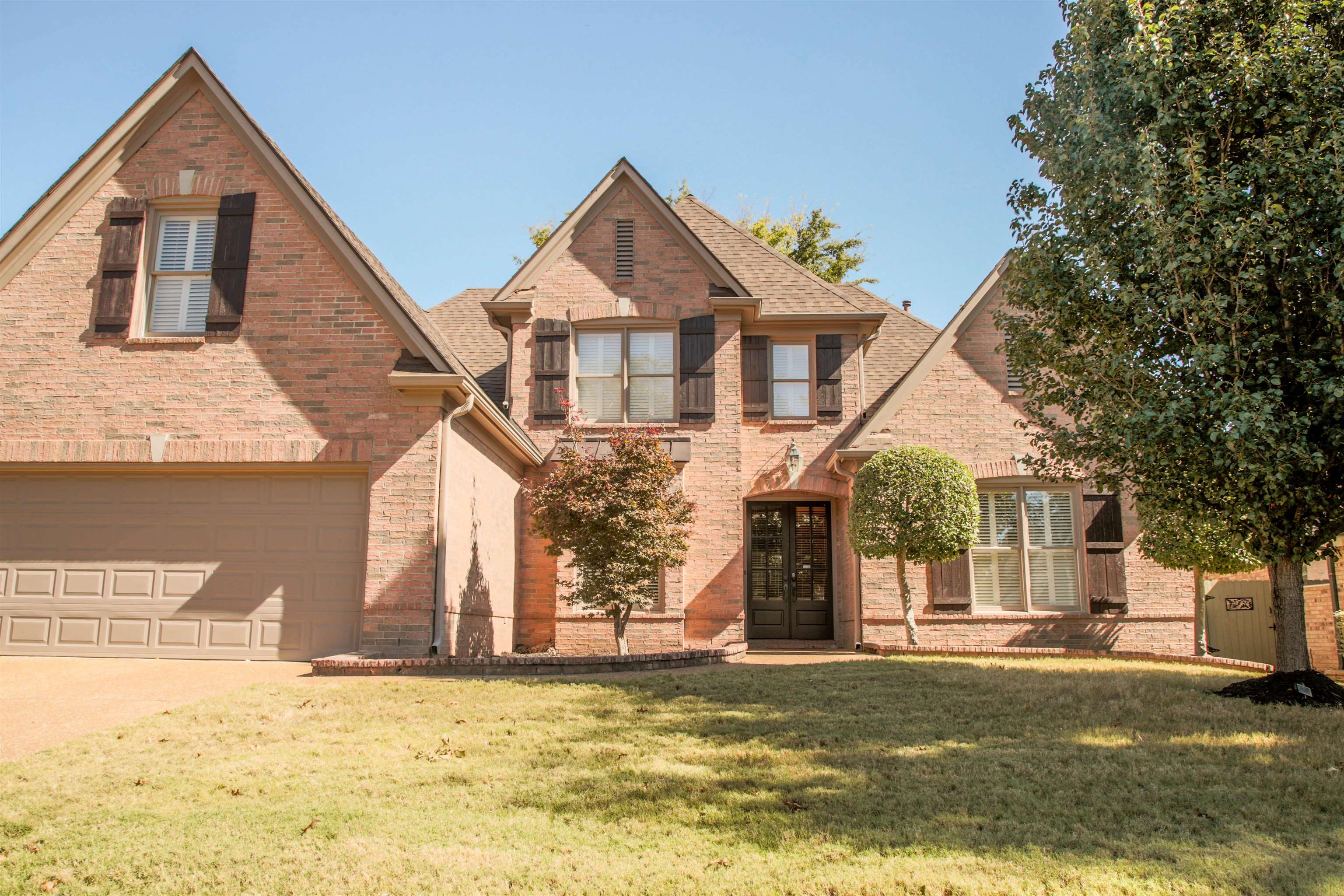 4868 Rainy Pass Road Collierville, TN 38017 - Photo 1 of 20 a front view of a house with a yard