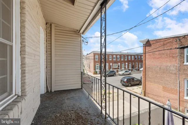 a view of a porch with a floor to ceiling window
