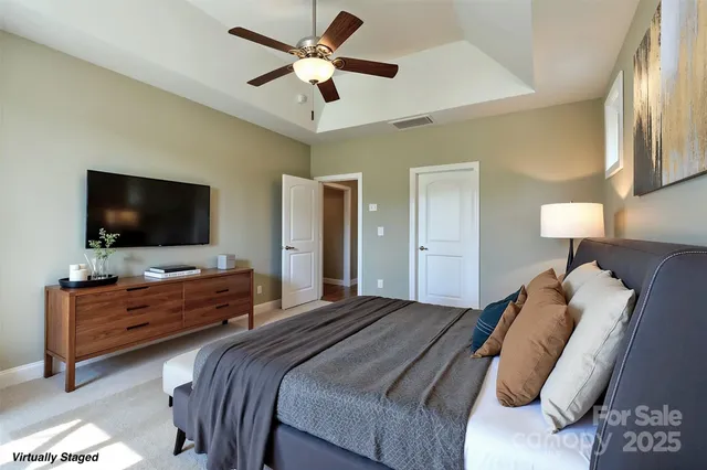 a spacious bathroom with a granite countertop sink a mirror and a shower