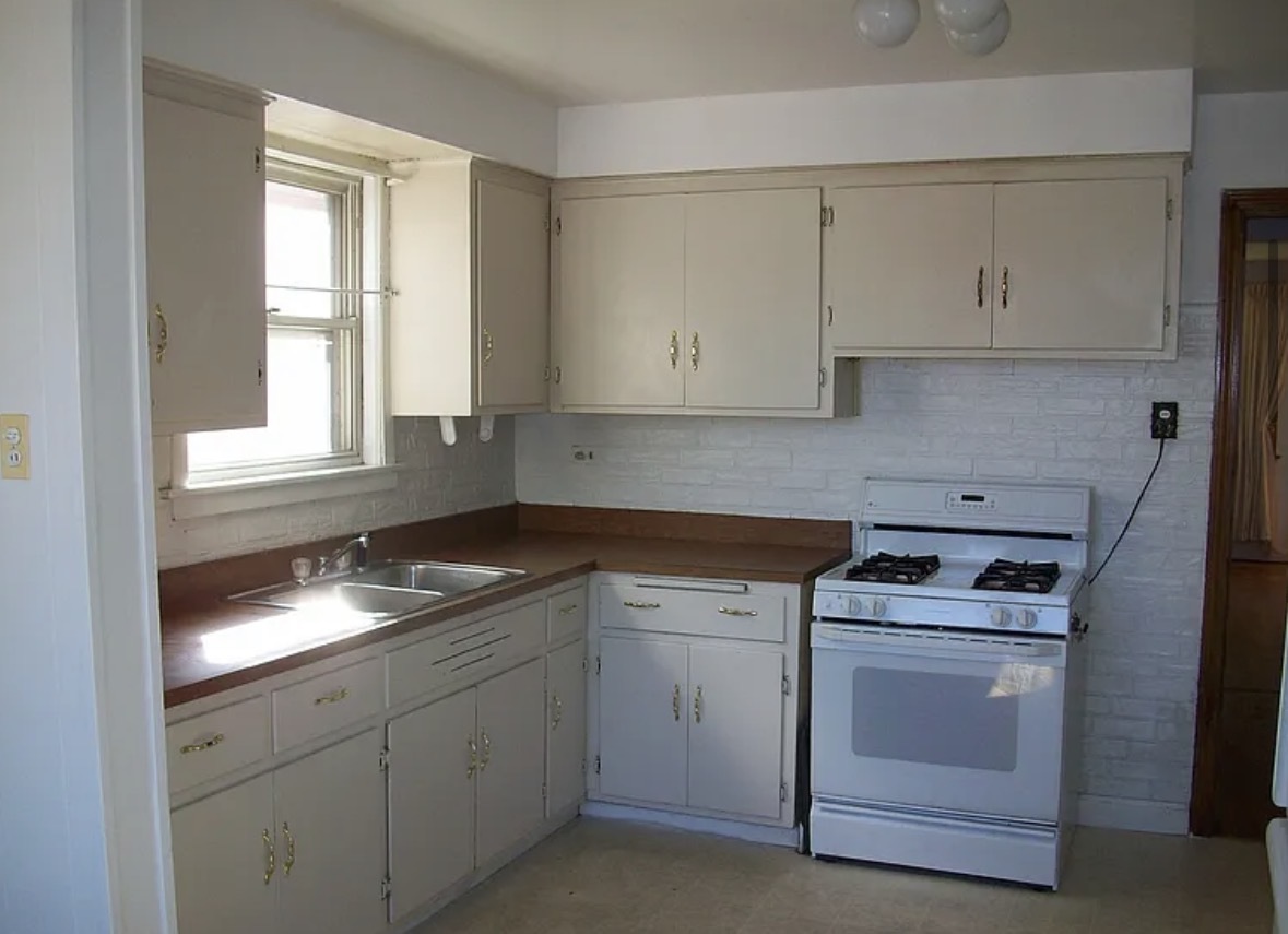 2433 Keystone Avenue North Riverside, IL 60546 - Photo 2 of 13 a kitchen with white cabinets and white appliances
