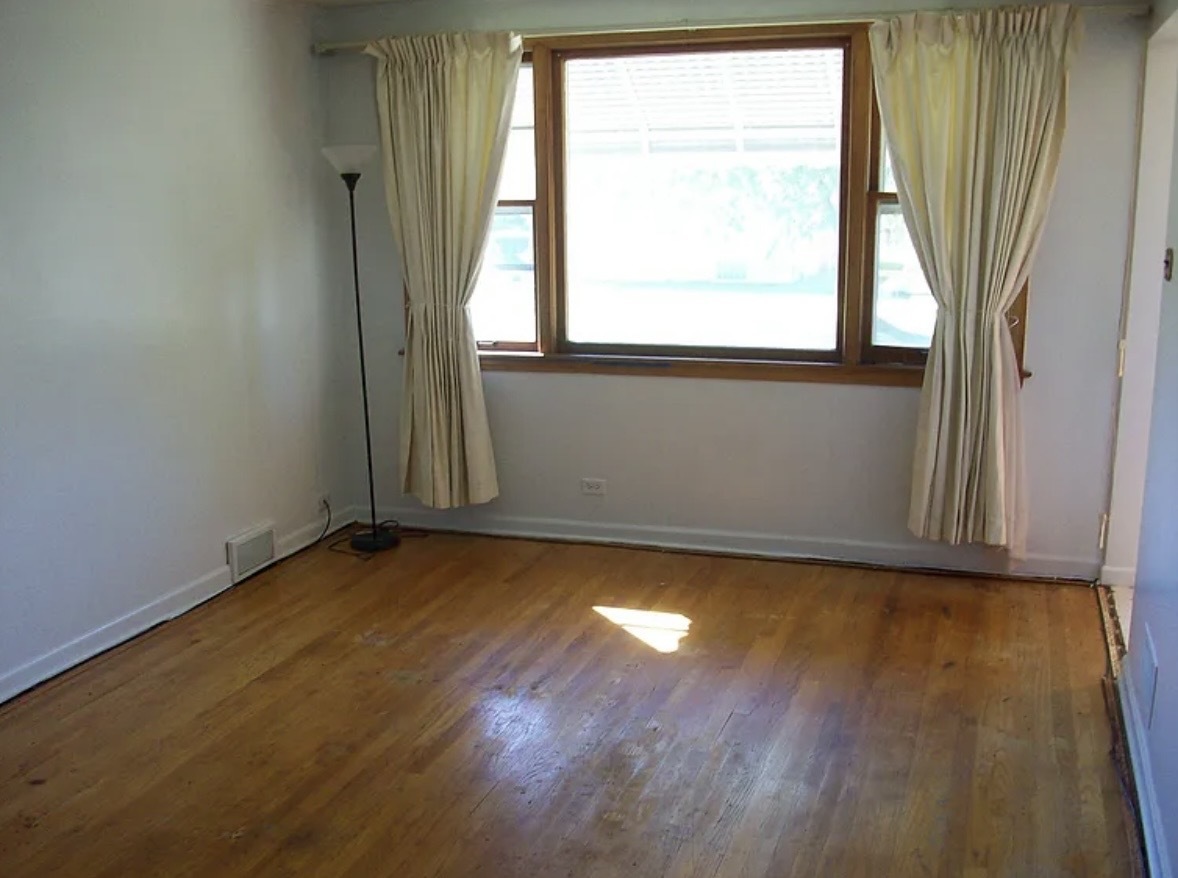 2433 Keystone Avenue North Riverside, IL 60546 - Photo 4 of 13 an empty room with wooden floor and windows