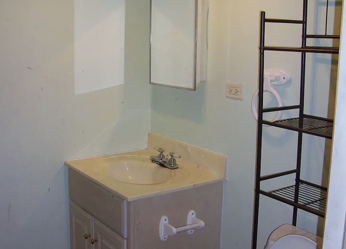 2433 Keystone Avenue North Riverside, IL 60546 - Photo 6 of 13 a bathroom with a sink and a mirror