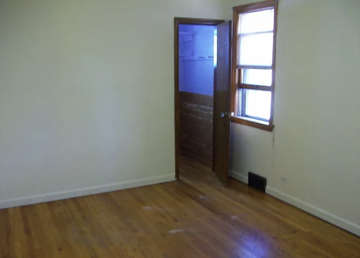 2433 Keystone Avenue North Riverside, IL 60546 - Photo 8 of 13 an empty room with windows closet and fireplace
